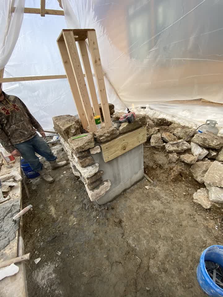 Stone pillar being formed inside the tent