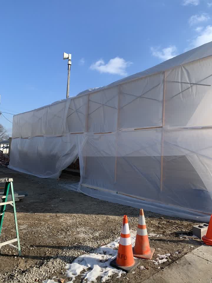 Tent enclosure set up over the work site