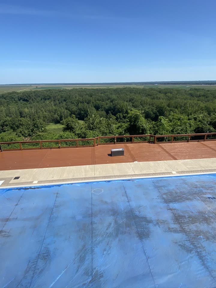 Freshly stained deck with pool and river valley view