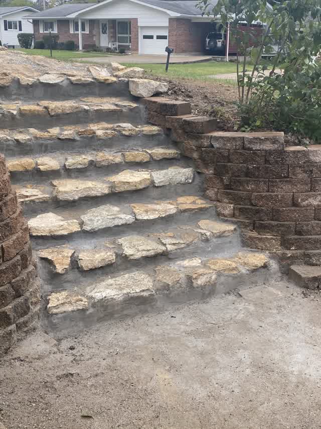 Wide view of flagstone steps with the house behind