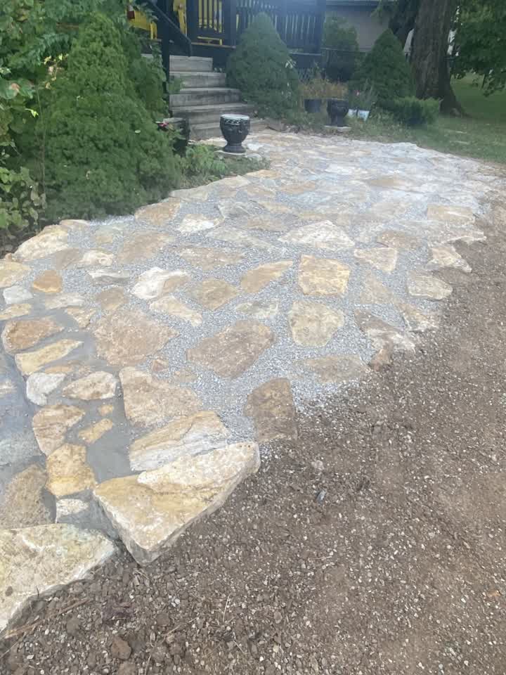 Flagstone walkway with stone edge beside the steps