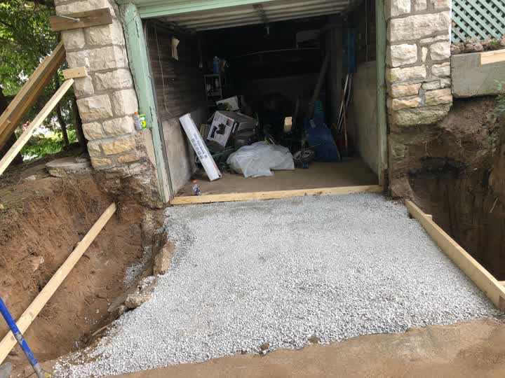 Gravel base prepped for the concrete driveway