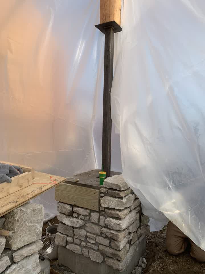 Stone pillar with the support post going up