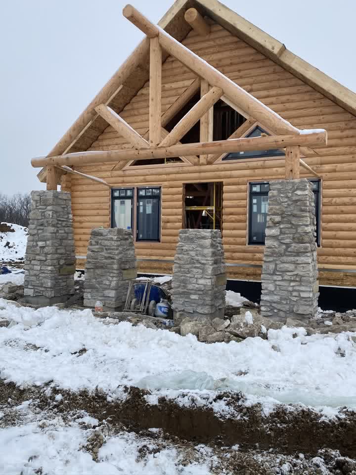 Stone pillars finished in winter snow