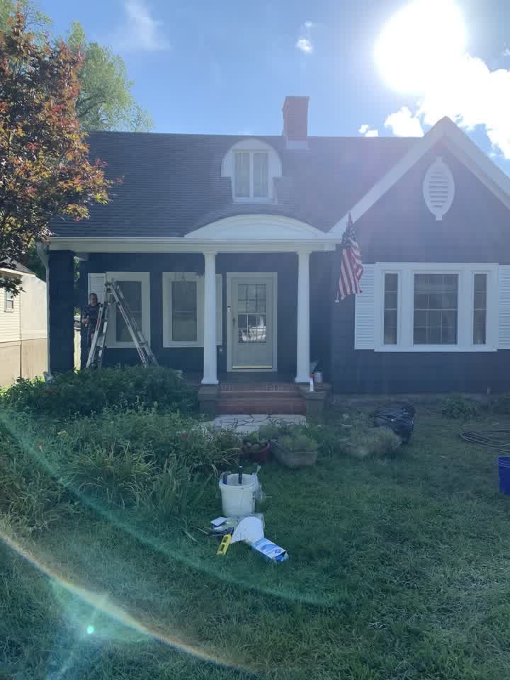 House exterior freshly painted dark blue