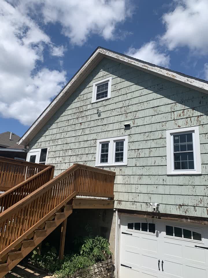 Badly weathered siding before painting