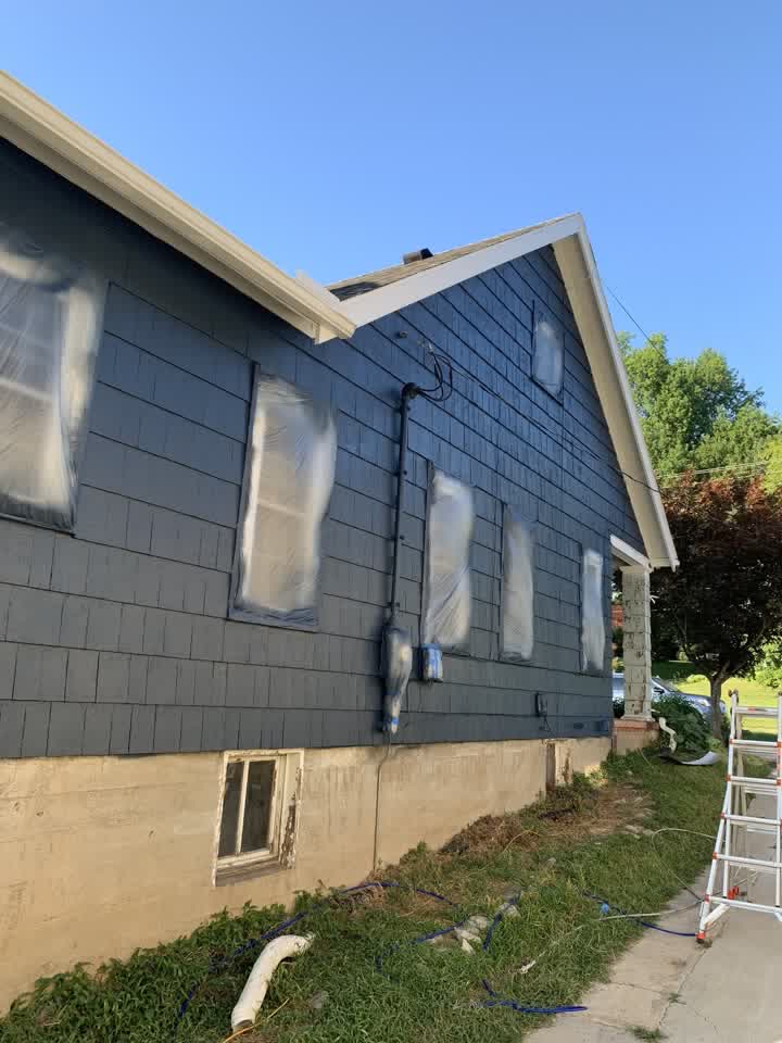 House masked and prepped for spraying