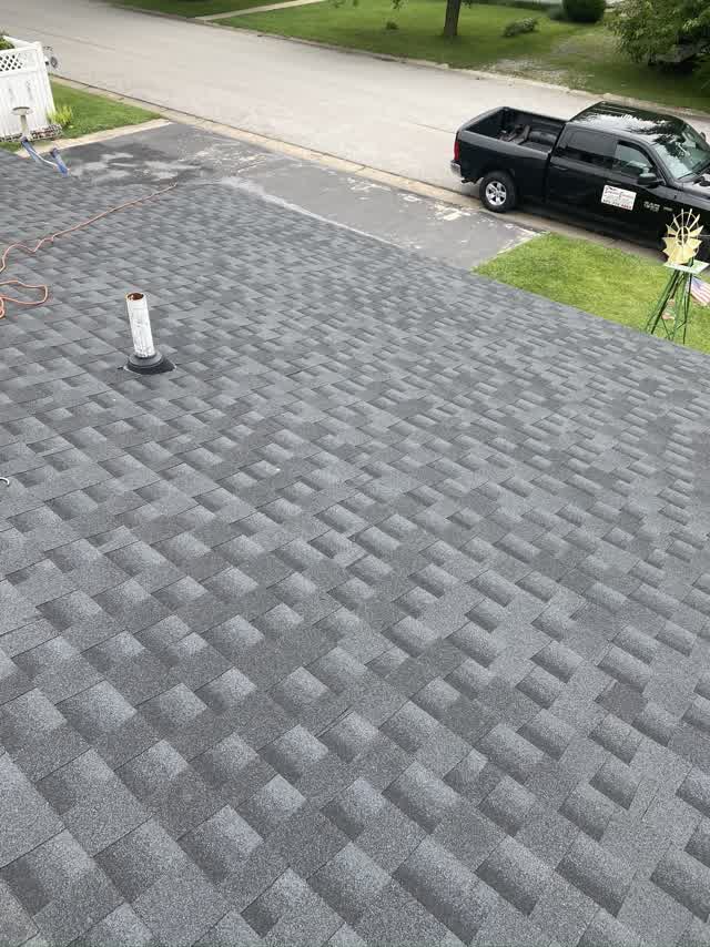 New gray shingle roof on the ranch home