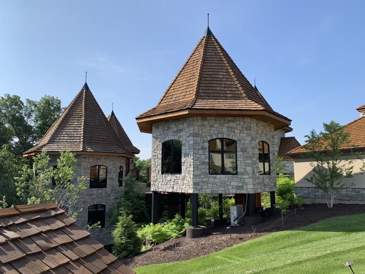 Close-up of the stone turret with new shake roofing