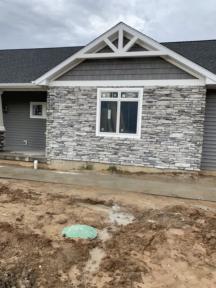 House with new dark shingle siding