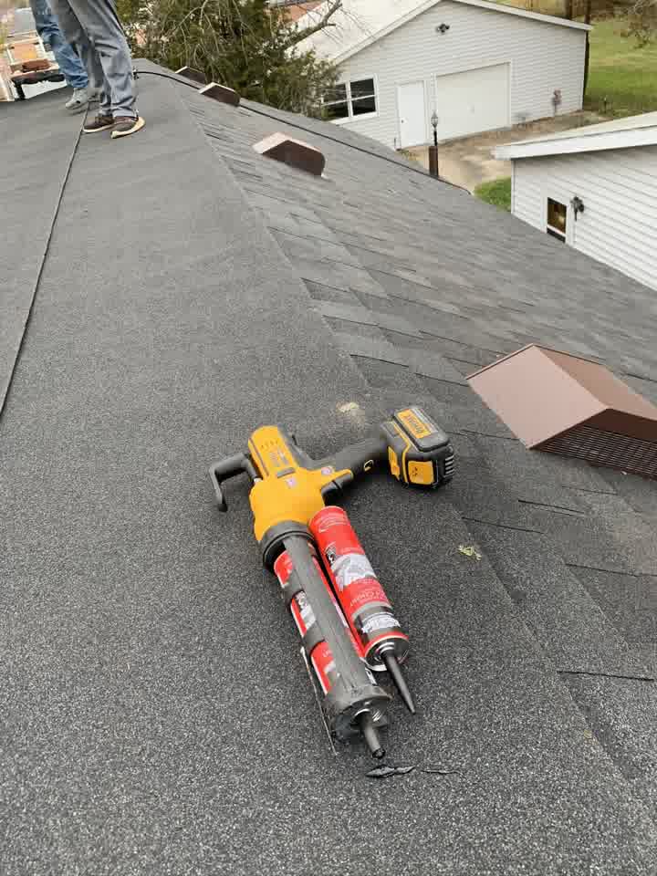 Crew working on the new shingle roof