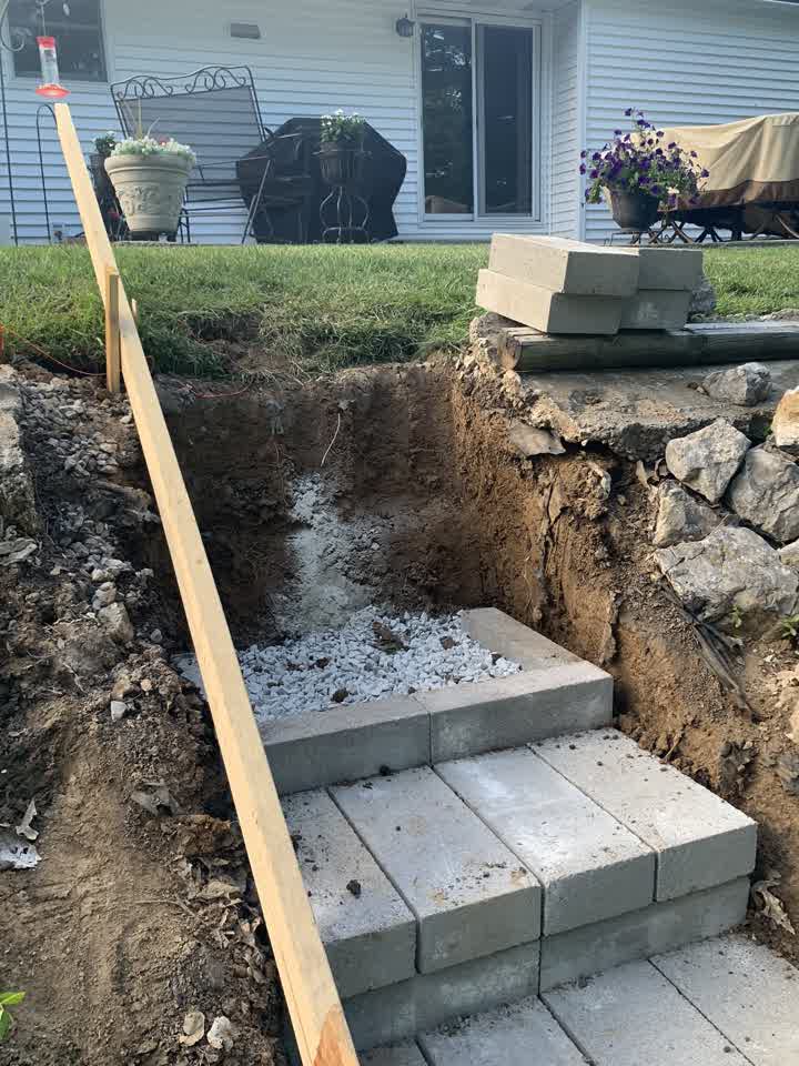 Excavation with gravel base for new block steps