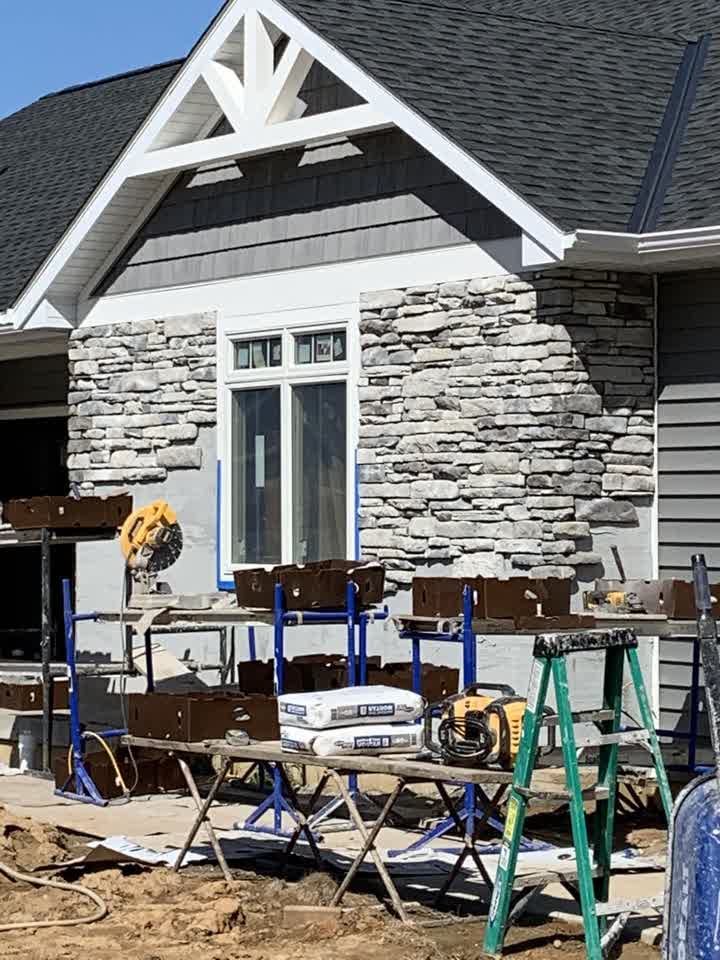 Stone veneer going up on the gable end